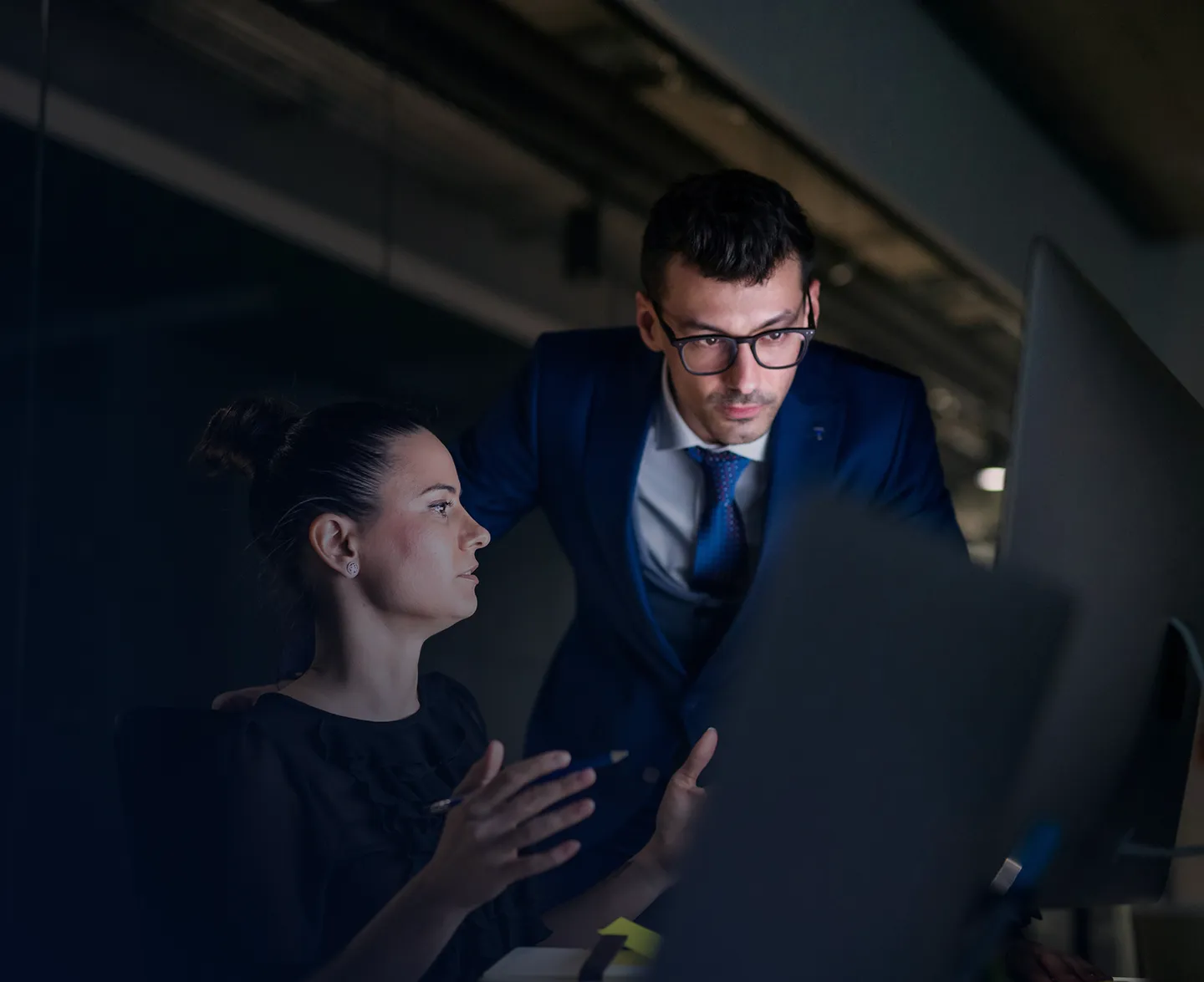 Two security professionals discussing data